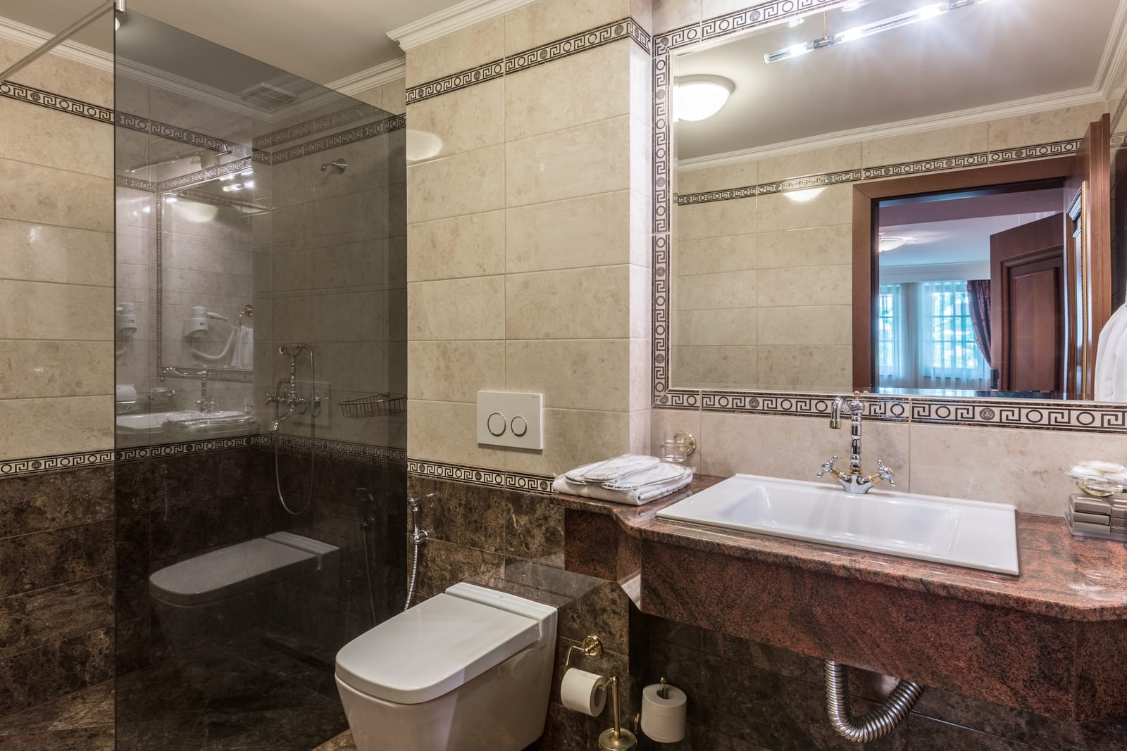 Marble bathroom with vanity, shower and heated towel rail