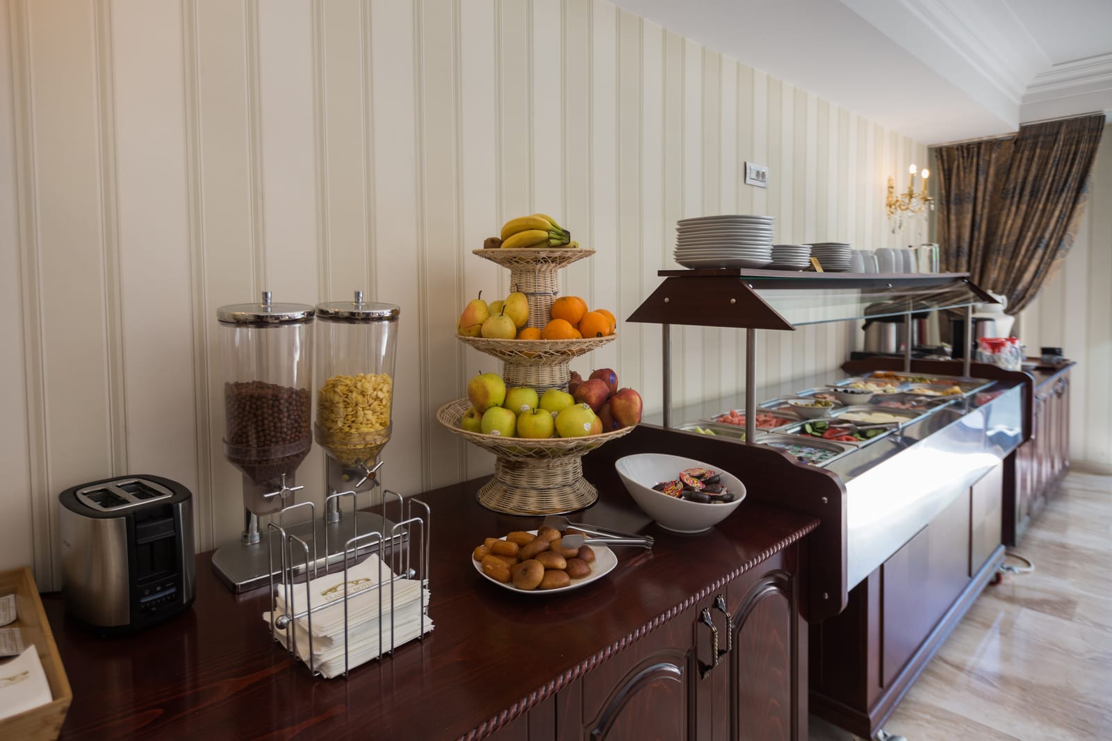 The breakfast buffet with fresh fruit, cereals and warm dishes