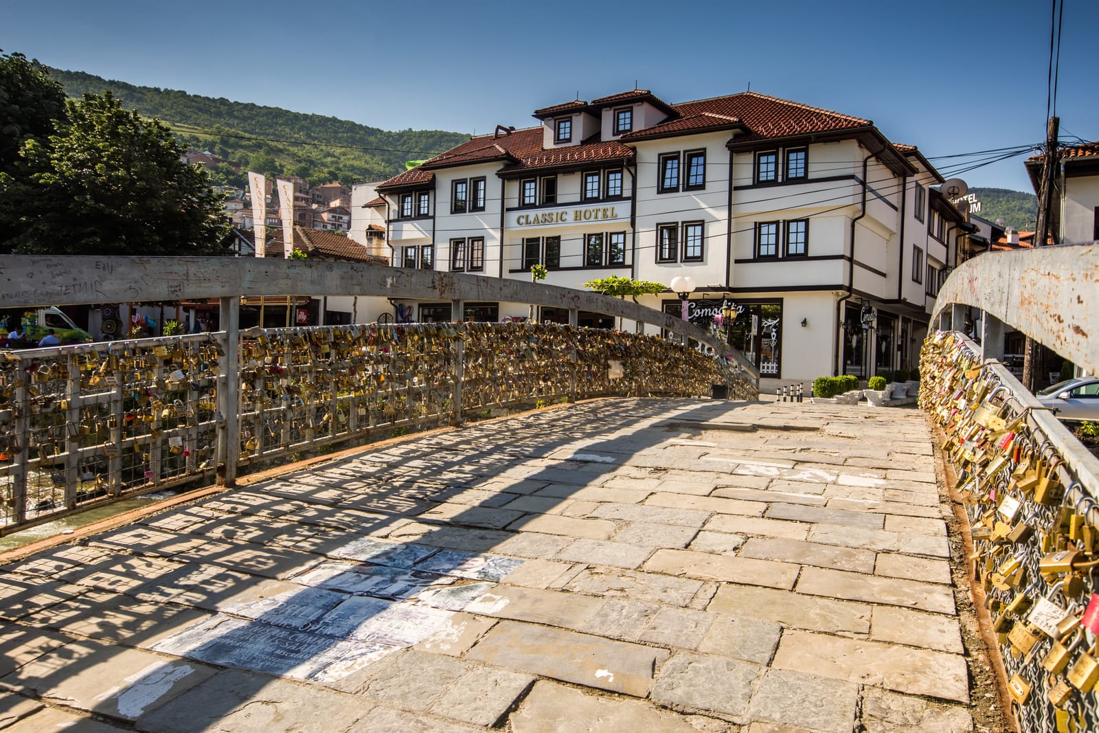 Classic Hotel seen from the padlock-covered Bridge of Love over the Lumbardhi river